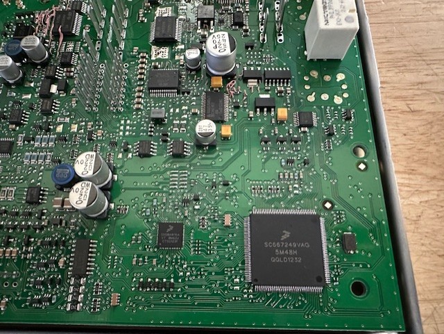 Disassembly of the BCM to access the CPU directly.  This CPU is a 5M48H which is critical to knowing how to decrypt the secured data.